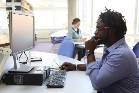 Student in Divinity Library (June 2017) ; photographed by Chris (Kip) Loades