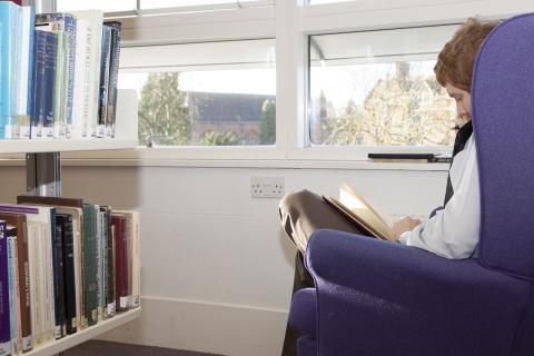 Student reading in the Library.